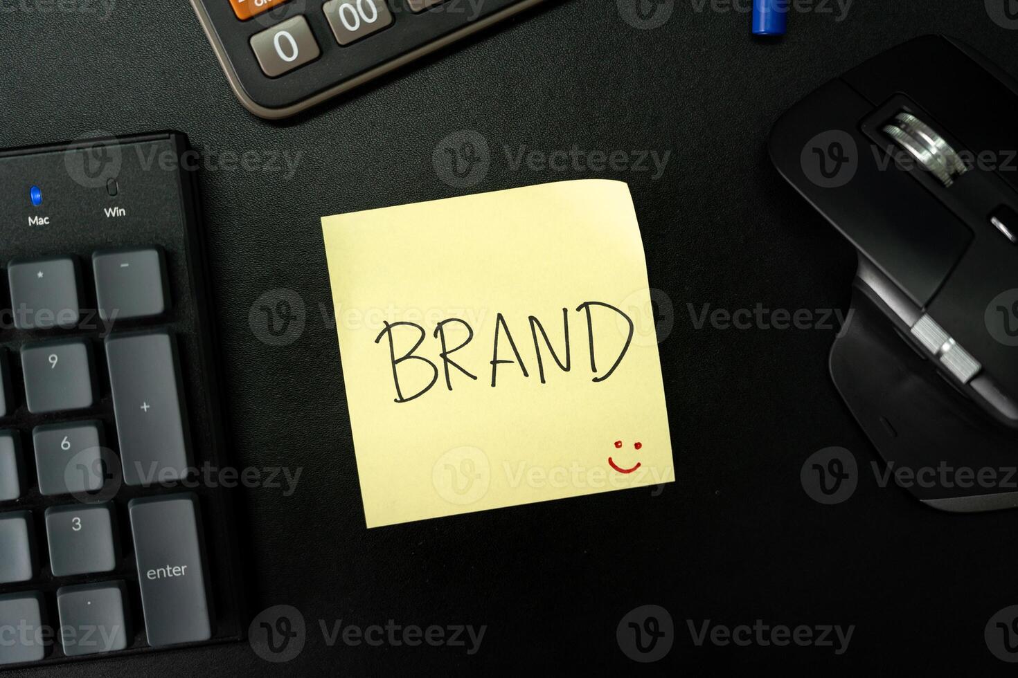 BRAND text with sticky note on keyboard. Build your Brand. Brand building, success, business. photo