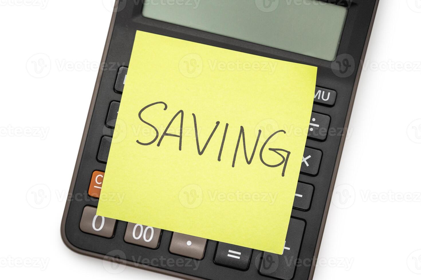 SAVING text with sticky note on calculator. financial concept. Saving money concept. Retirement concept. photo