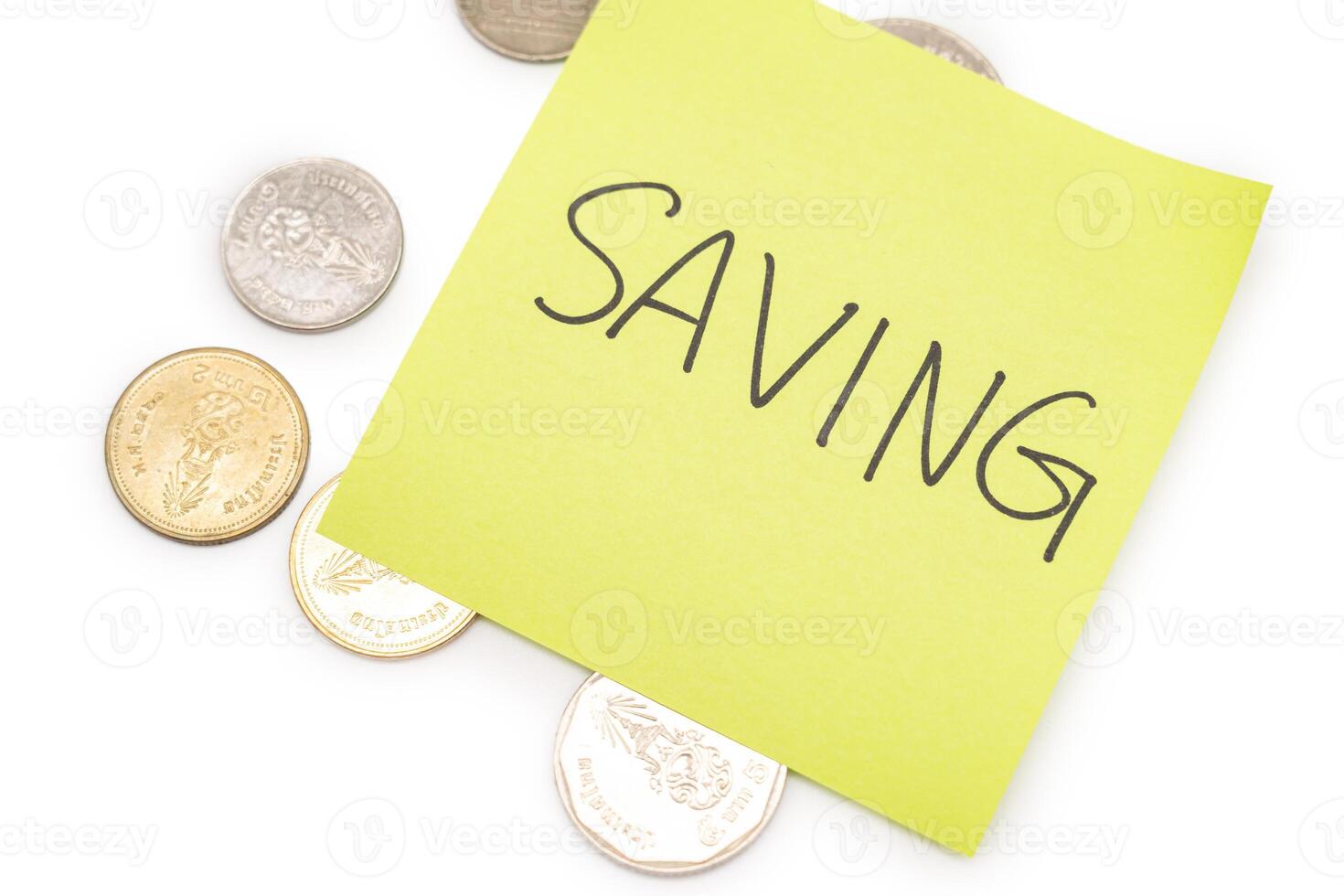 SAVING text with sticky note on Thai Baht coins. financial concept. Saving money concept. Retirement concept. Pension calculation concept. photo