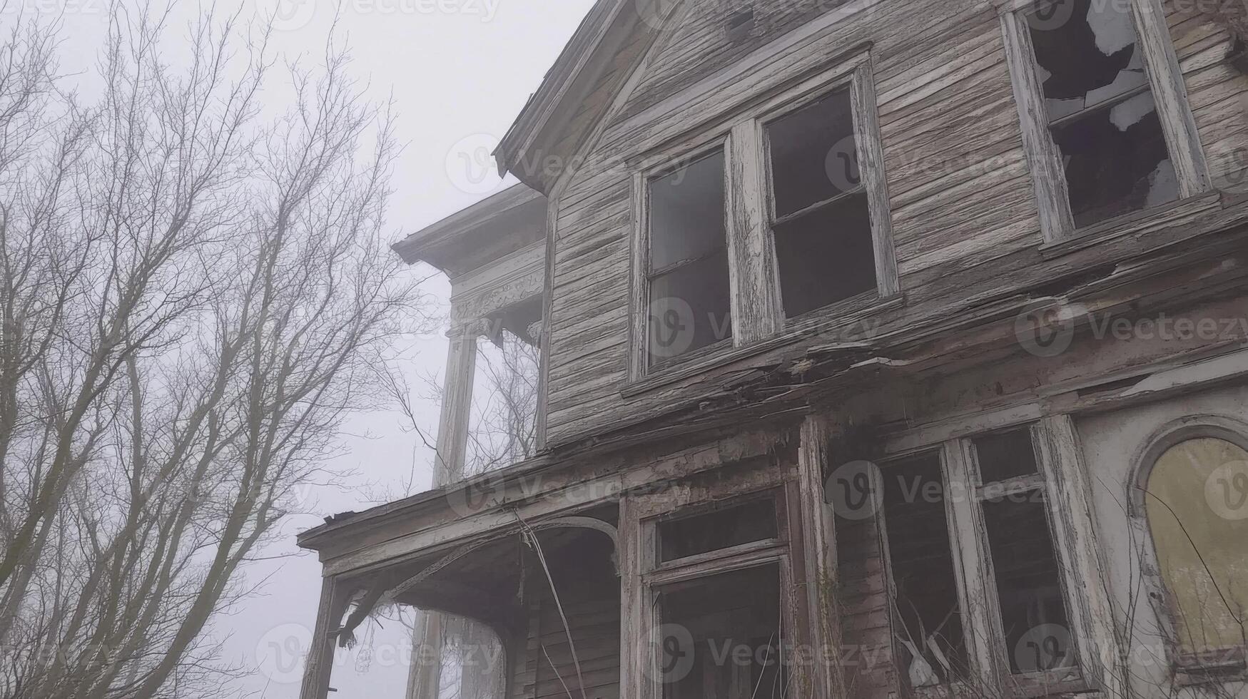 An old abandoned house in the fog photo
