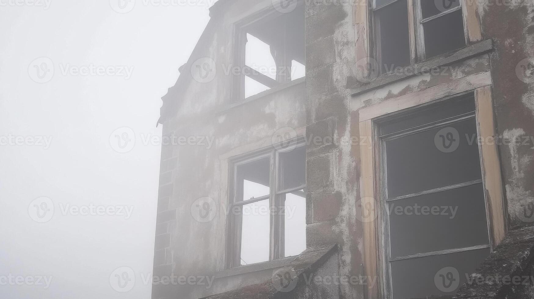 An old abandoned building is in the fog photo