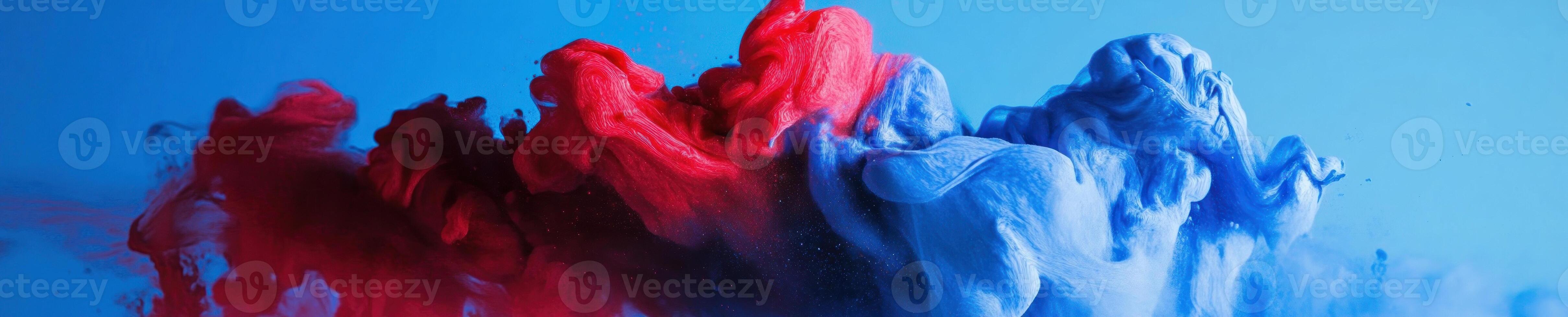 Energetic burst of red and blue paint mixing in dynamic motion photo