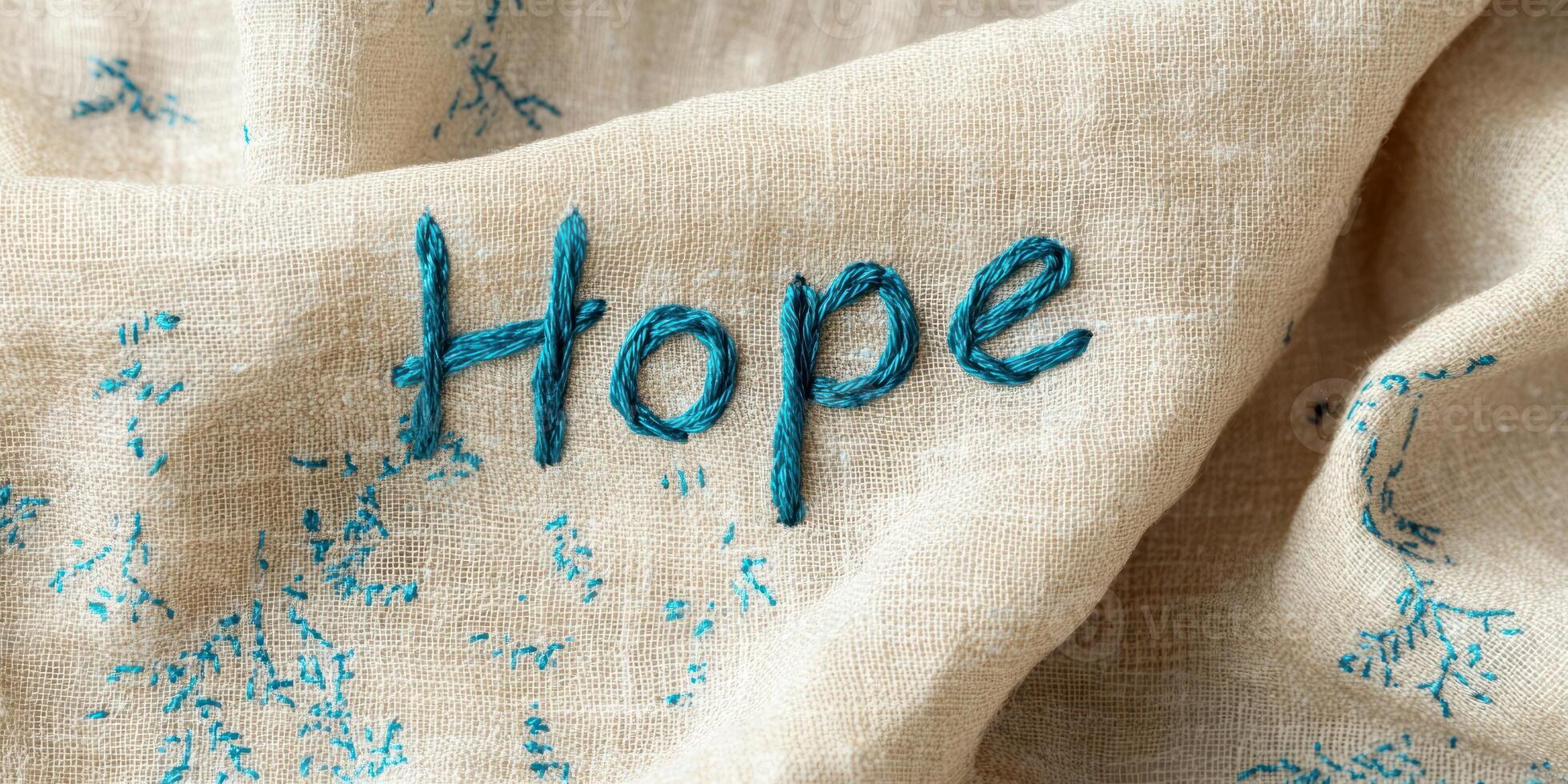 Hope embroidered on fabric with childlike handwriting for inspirational design photo