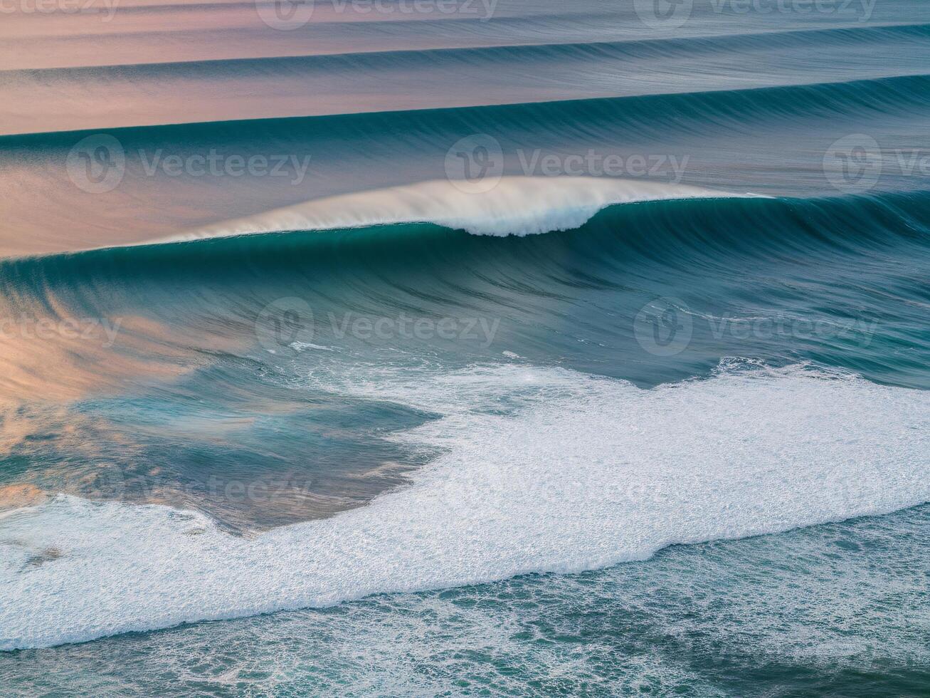 Majestic turquoise waves gently rolling onto the shore at sunset, creating a serene coastal atmosphere. photo
