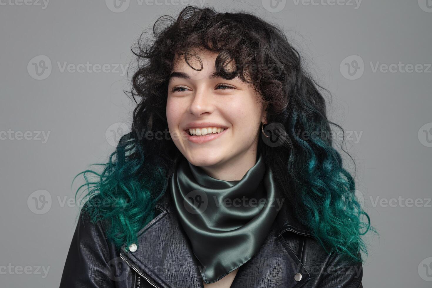 A woman with green hair and a leather jacket photo