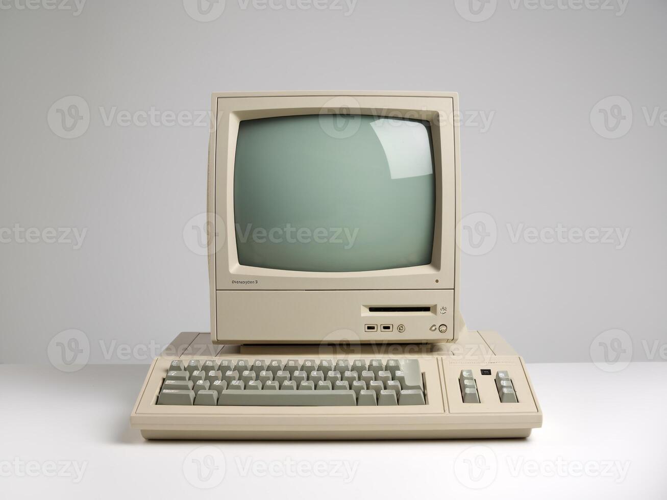 An old computer with a keyboard and monitor photo