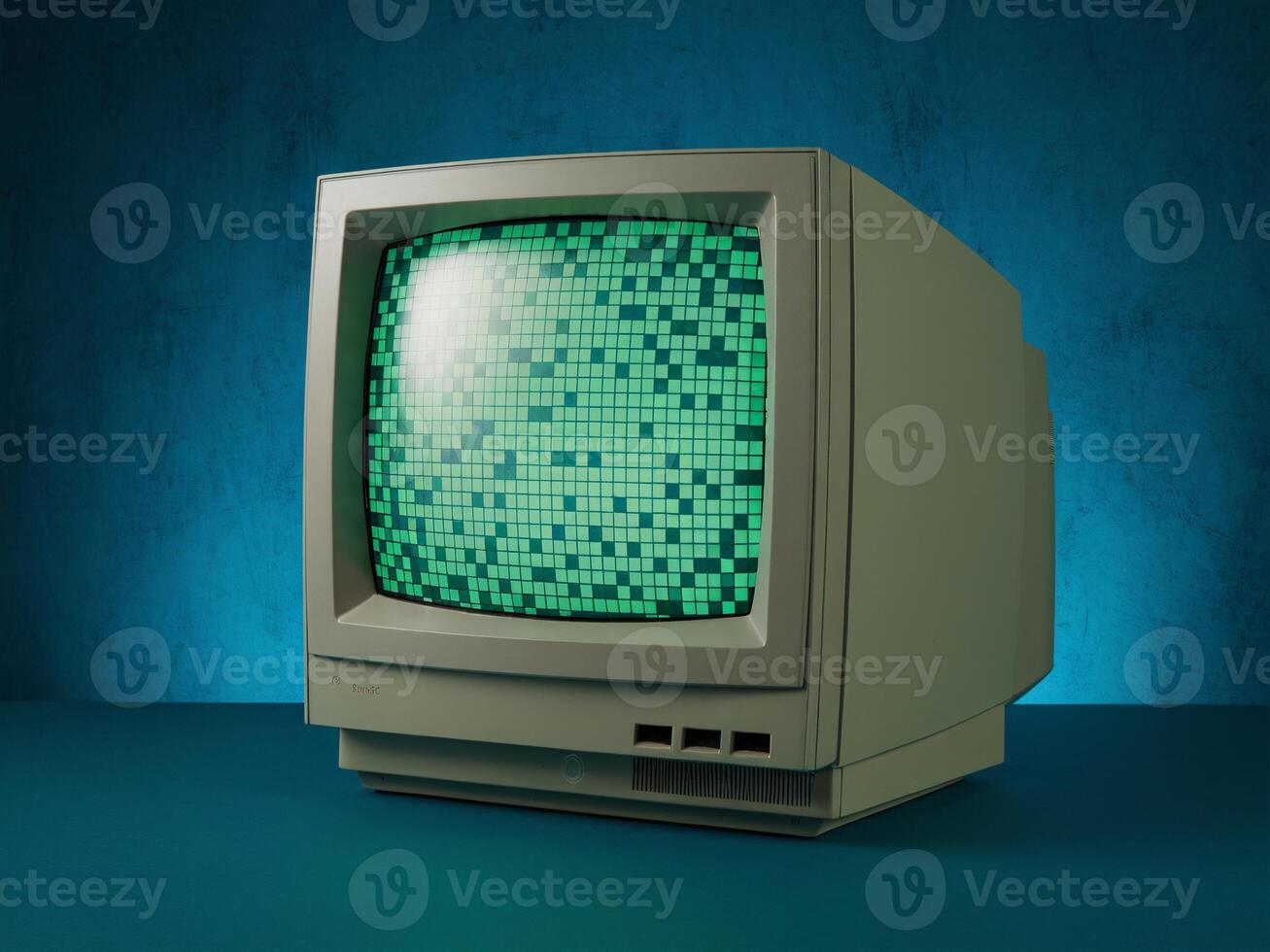 An old computer with green pixels on the screen photo