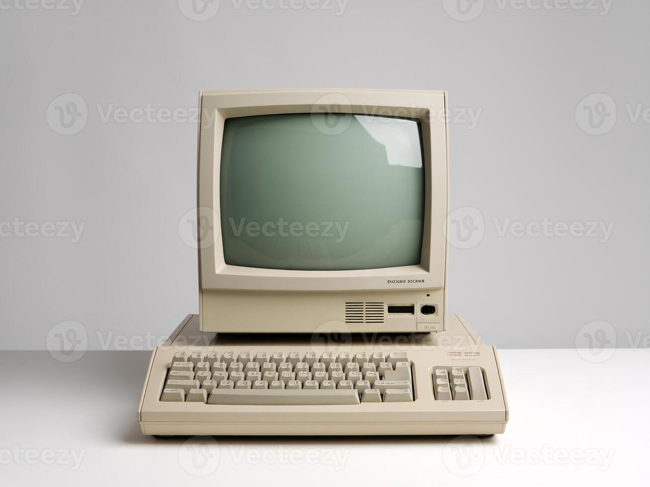 Vintage computer with a beige monitor and keyboard against a minimalistic backdrop. photo