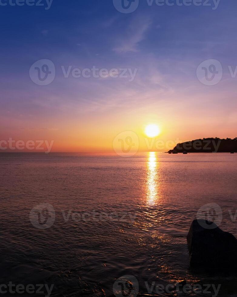 Sunrise Sky,Cloud over Sea Blue Ocean in morning with Sunlight in Orange,Yellow Colour for nature background,Summer sunset dramatic dusk sky, cloudy by beach,Horizon Beautiful dramatic sky in Winter photo