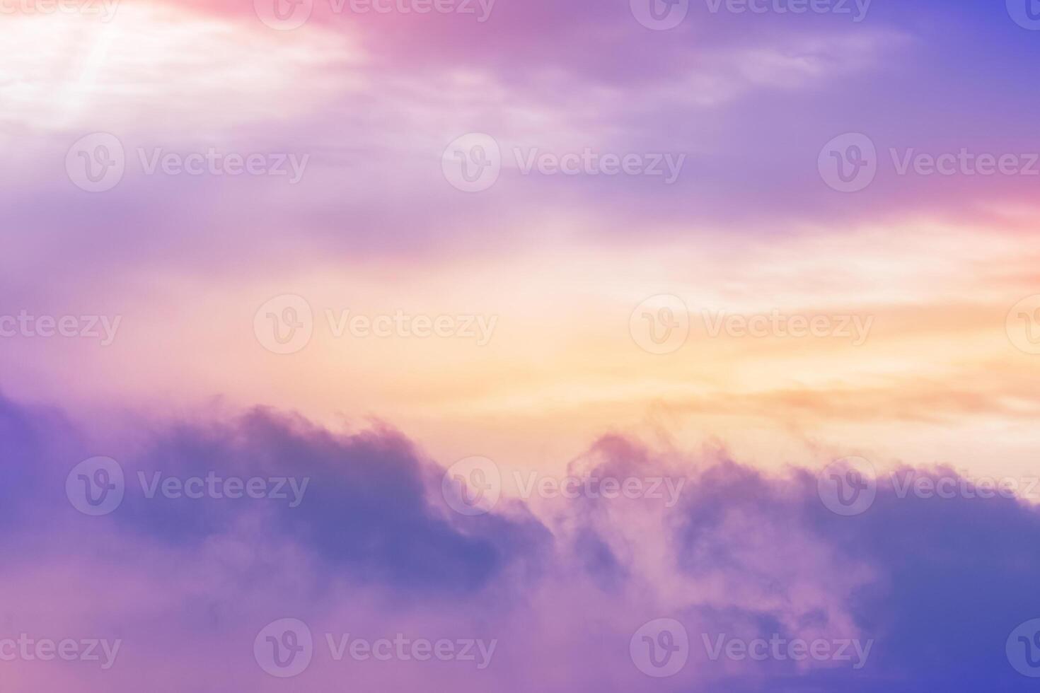 Sunset Sky background,Dramatic clouds, colourful twilight sky in purple, pink, blue, yellow, orange sky in evening Winter.Nature background golden hour of dusk sky photo