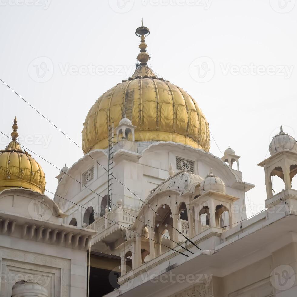The golden domes of the golden temple in amritsar, india photo