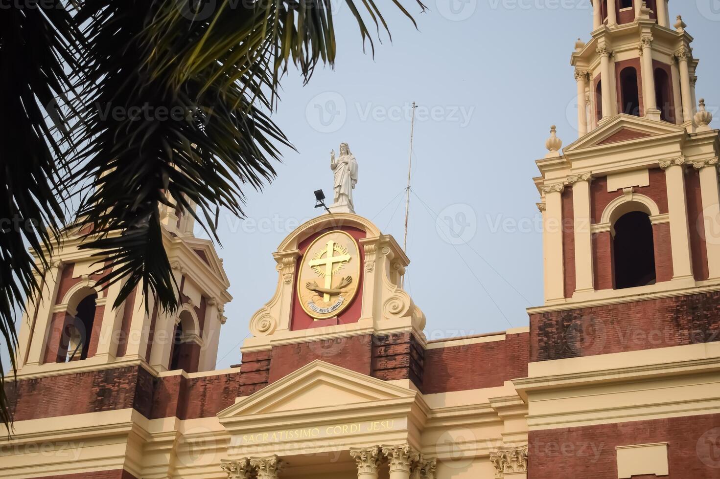 A large church with a clock on top of it photo