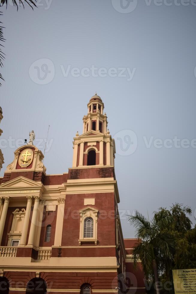 A large red brick building with a clock tower photo