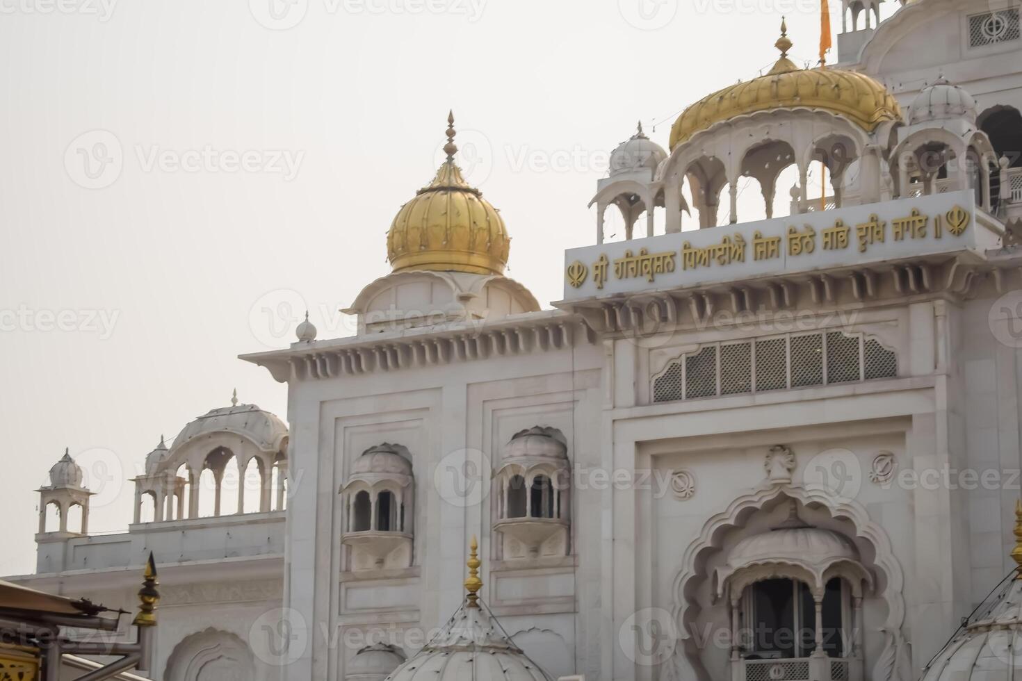 A white building with gold domes photo