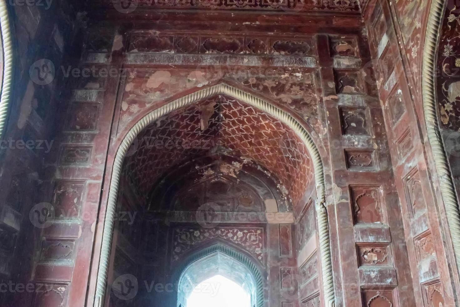 The inside of a building with intricate carvings photo