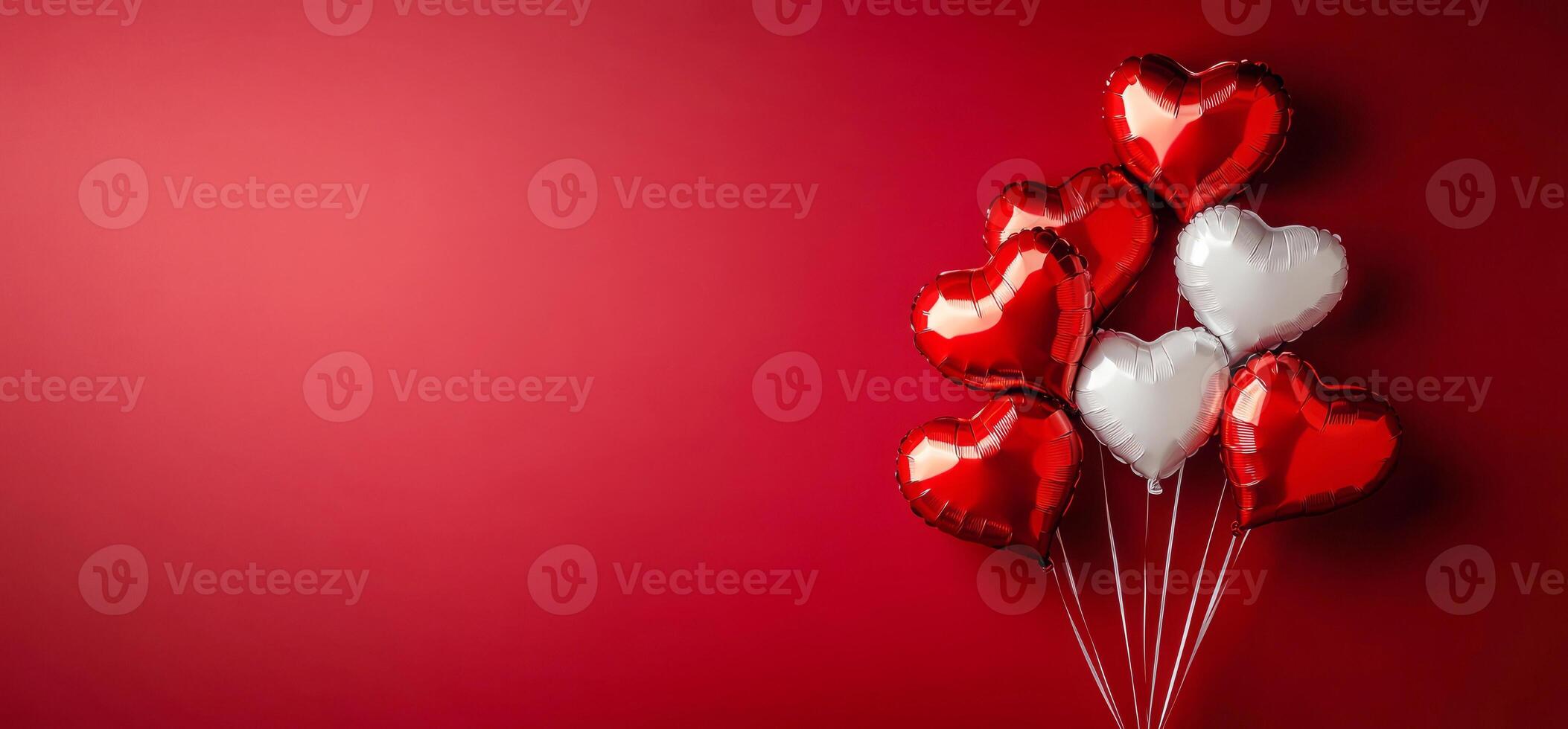 Balloons in the shape of hearts floating on a bright red background are perfect for Valentine's Day celebrations or romantic celebrations. photo
