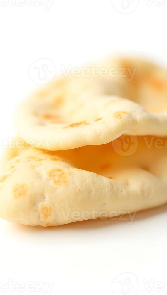 Extreme closeup of soft and fluffy naan bread on a plain background photo