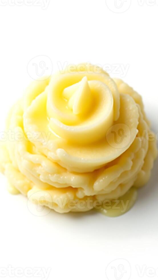 Delicate closeup of creamy butter shaped like a rose on a white plate photo