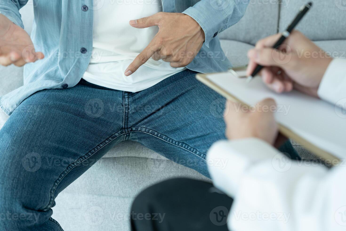 Man hold hand in front of private parts feeling discomfort and consult doctor. Venereal, testicular cancer. bladder problems, erectile dysfunction, premature ejaculation, prostate cancer. photo