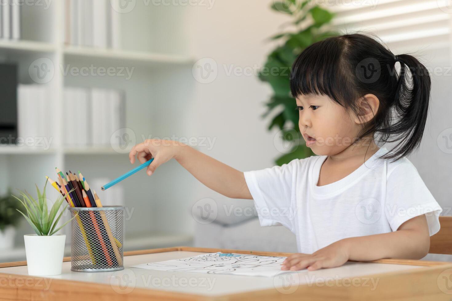 Happy Asia children playing learning paint on paper. Activity, development, IQ, EQ, meditation, brain, muscles, essential skills, family having fun spending time together photo