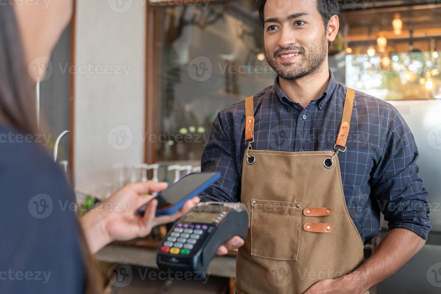 Happy Owner recieve scan QR code to pay in cafe restaurant with a digital payment without cash. Choose menu and order accumulate discount. E wallet, technology, pay online, credit card, bank app. photo