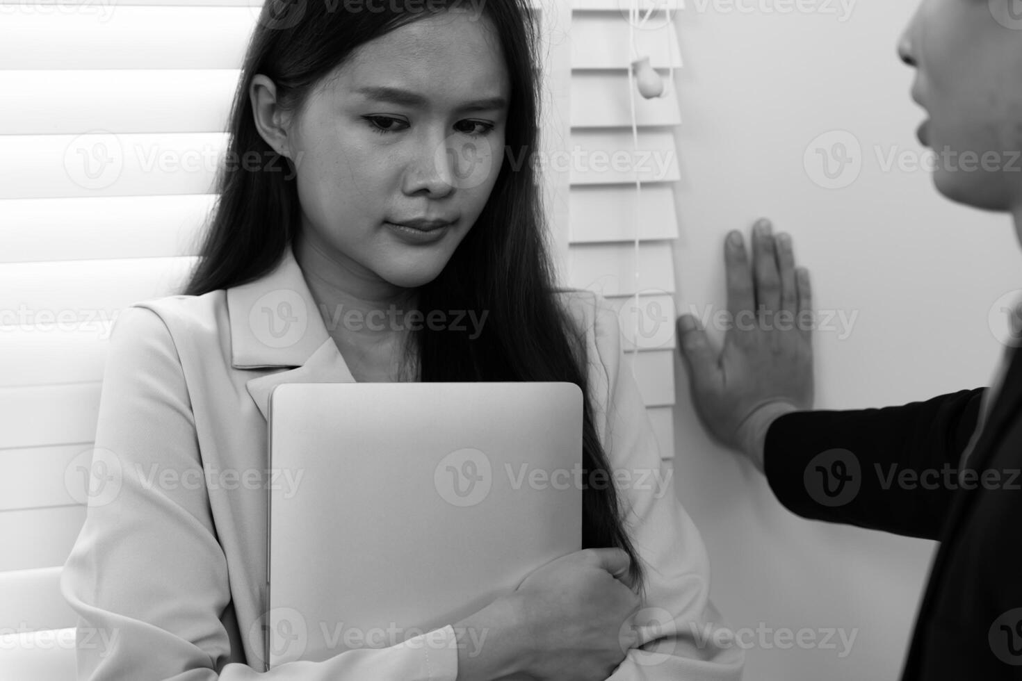 Manager or senior sexually harassed a female colleague. Sexual harassment in office. feel anxious and stressed from being harassed. molest, assault, inappropriate, discrimination photo