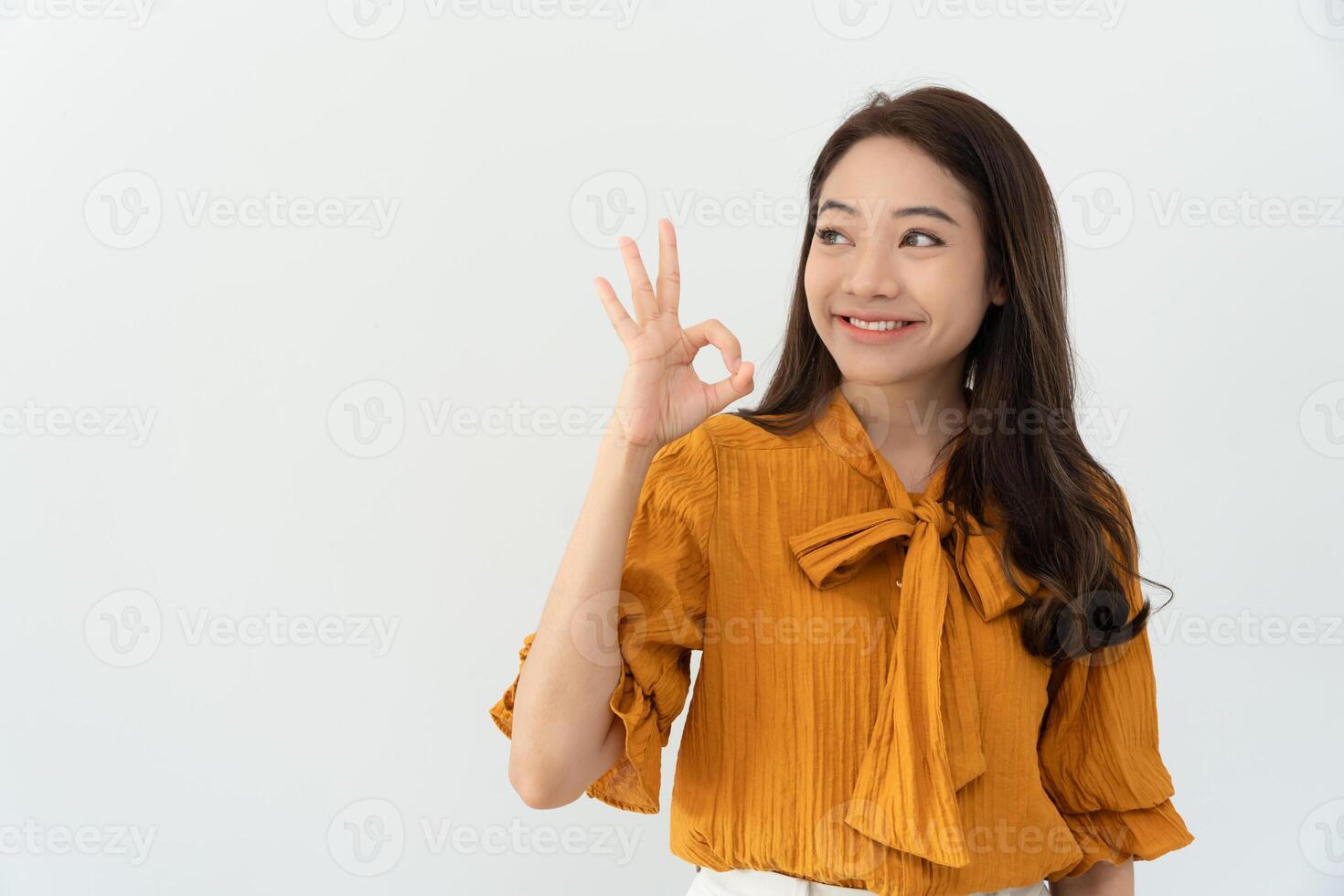 Portrait Asian beautiful woman exited surprise and showed OK hand sign . female feels happy. exciting smile and happy adorable rejoices. Very enjoy and fun relax time. wow and Smile. photo