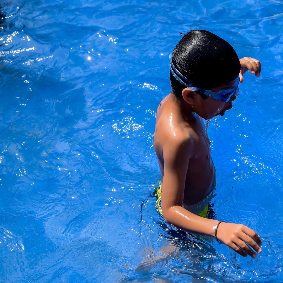 A young boy in a pool photo