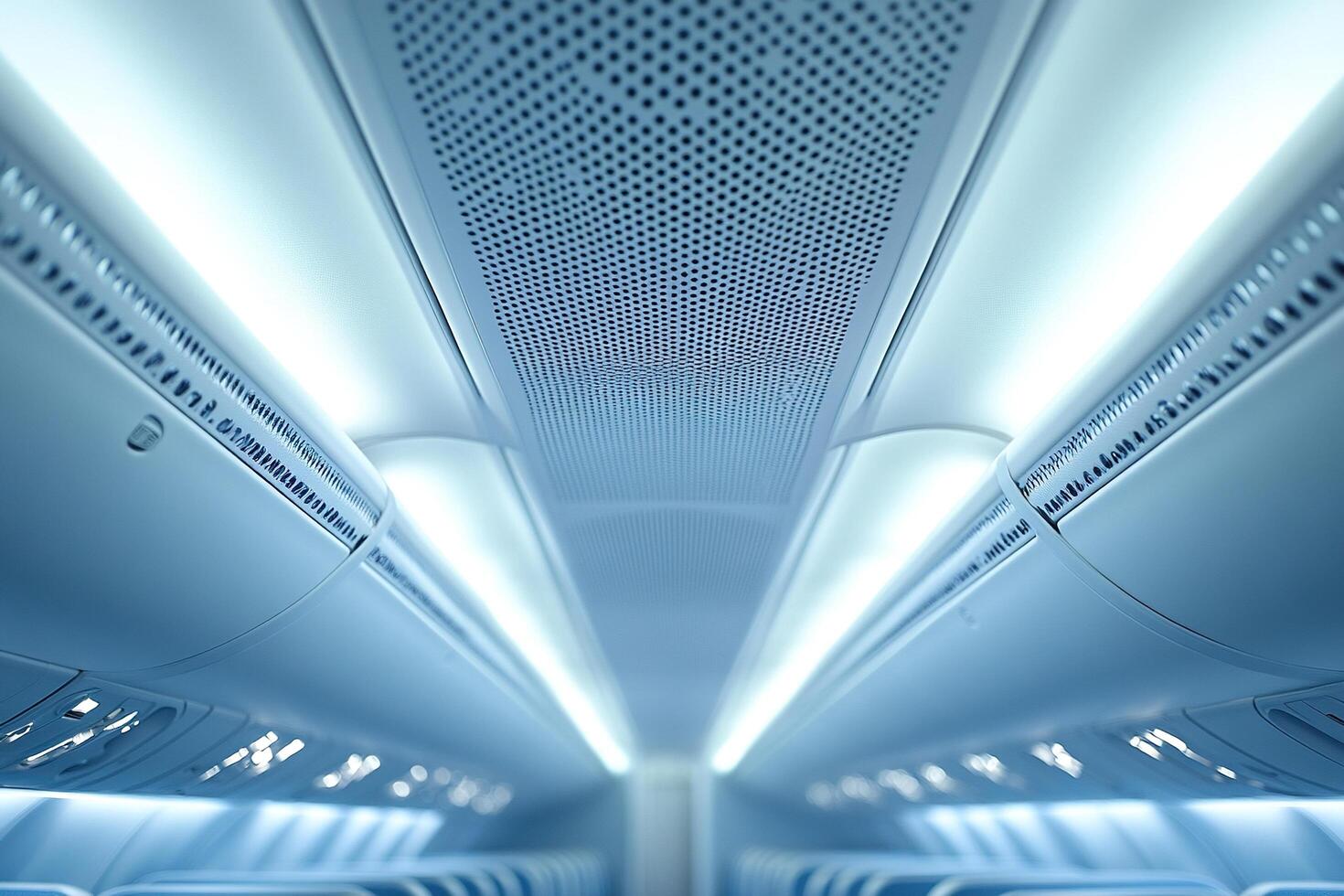 Passenger airplane cabin in detail. Roof and luggage compartment above passenger seats close-up. photo