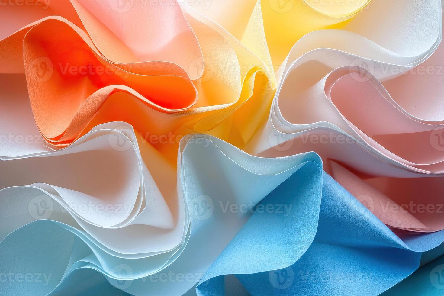 Background macro image of origami from curved sheets of paper. Top view of standing sheets of thick colored paper. Abstract background of paper pages. photo