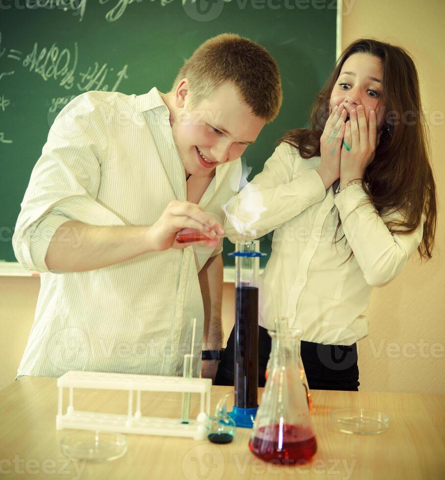 two students working in chemistry laboratory at the classroom photo