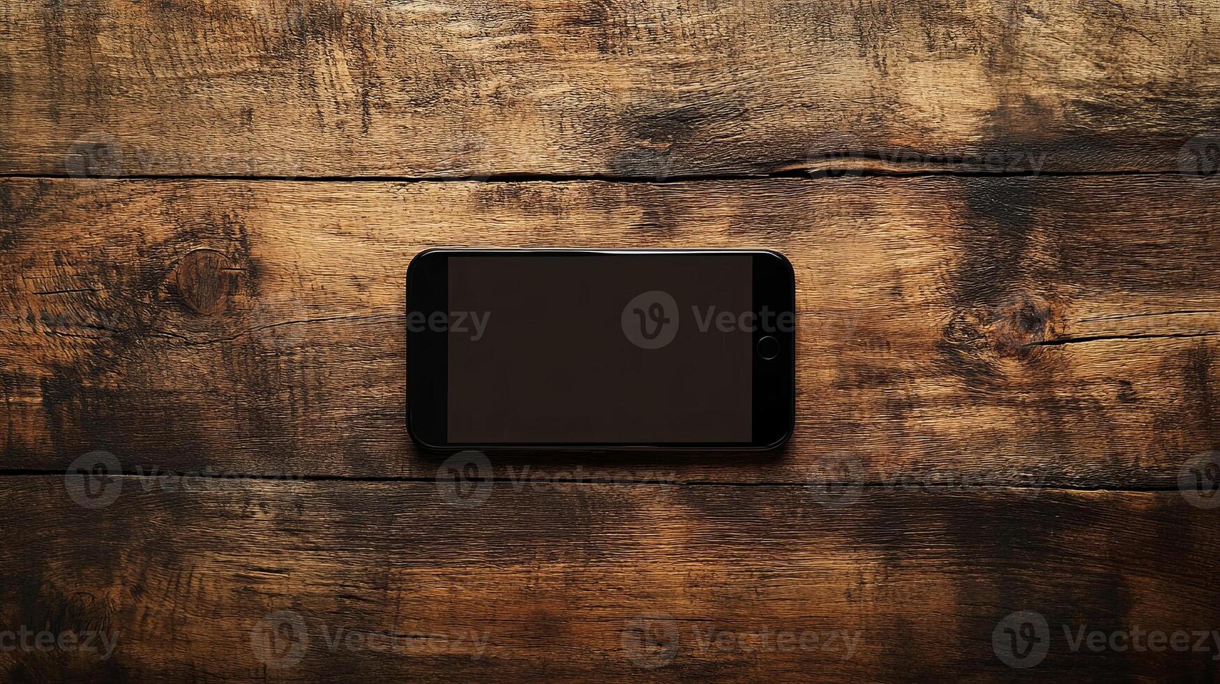 A sleek smartphone rests on a rustic wooden table, showcasing a blend of modern technology and natural aesthetics photo