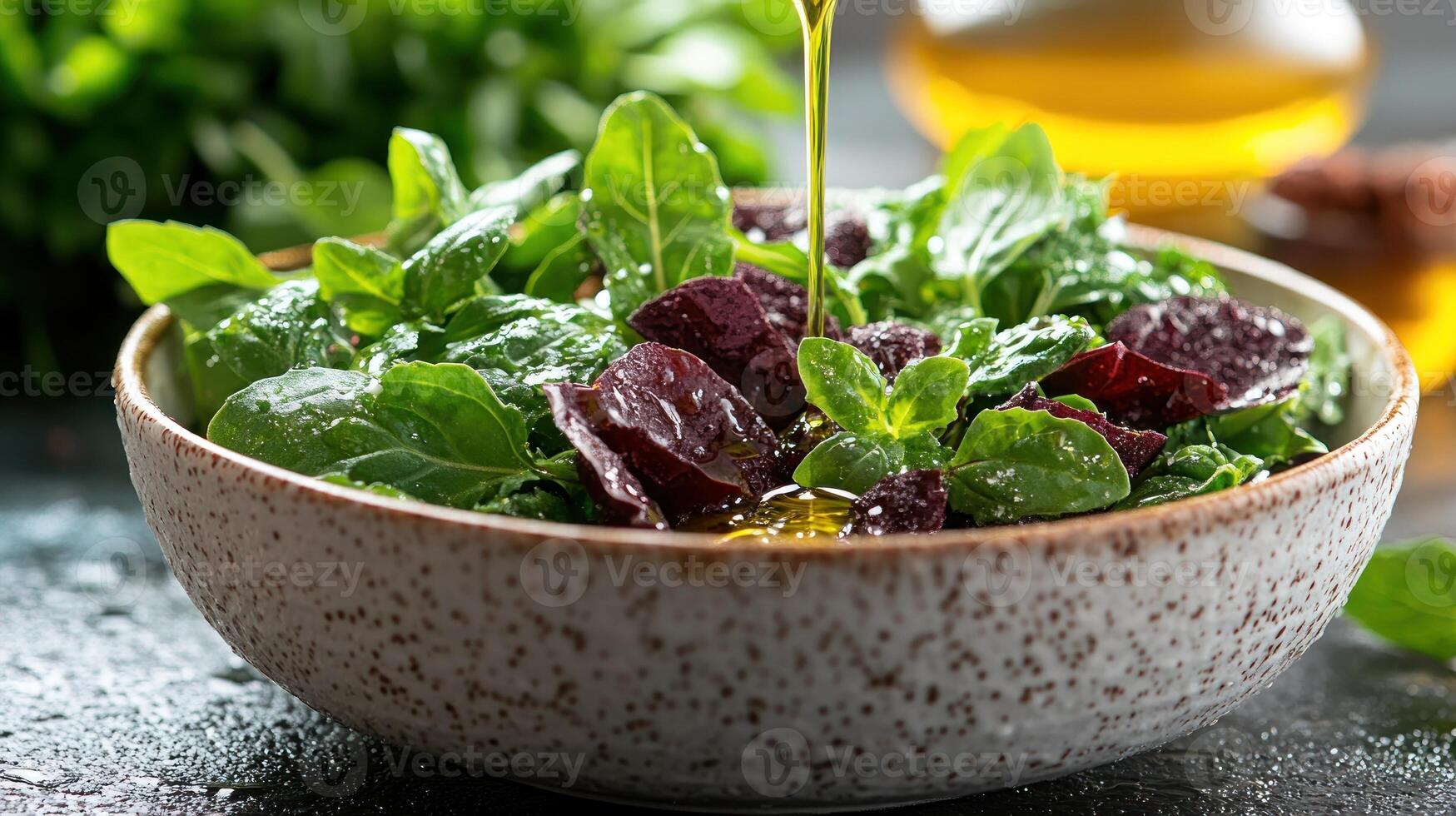 A bowl of salad with greens and olive oil photo