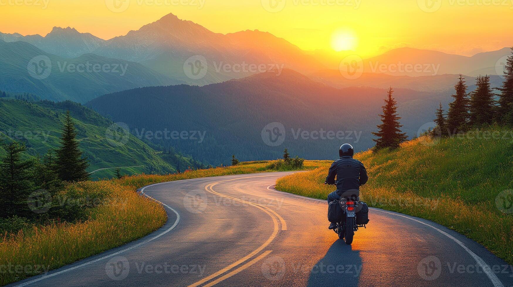 A person riding a motorcycle on a winding road photo