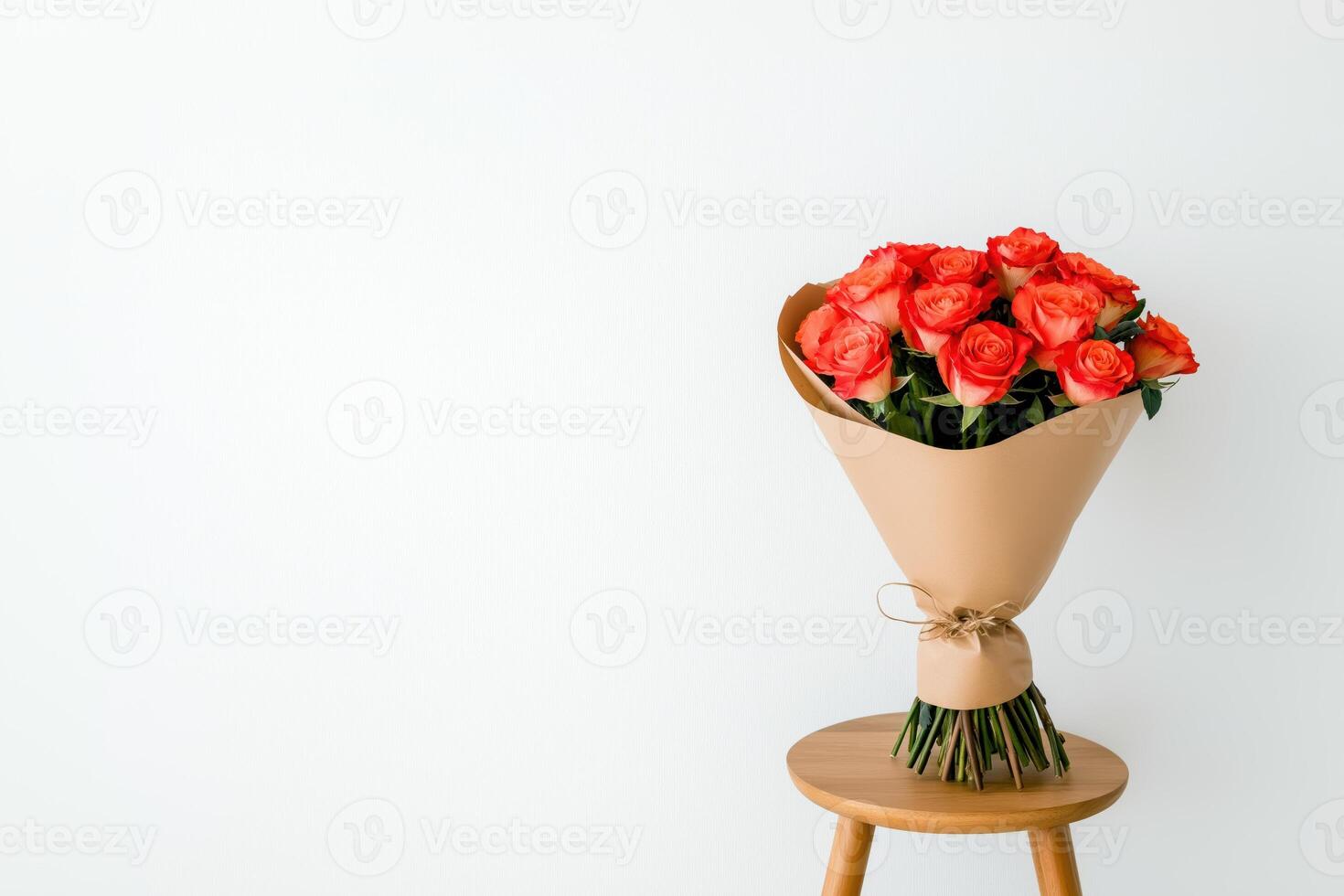 Elegant bouquet of red roses on wooden stool photo