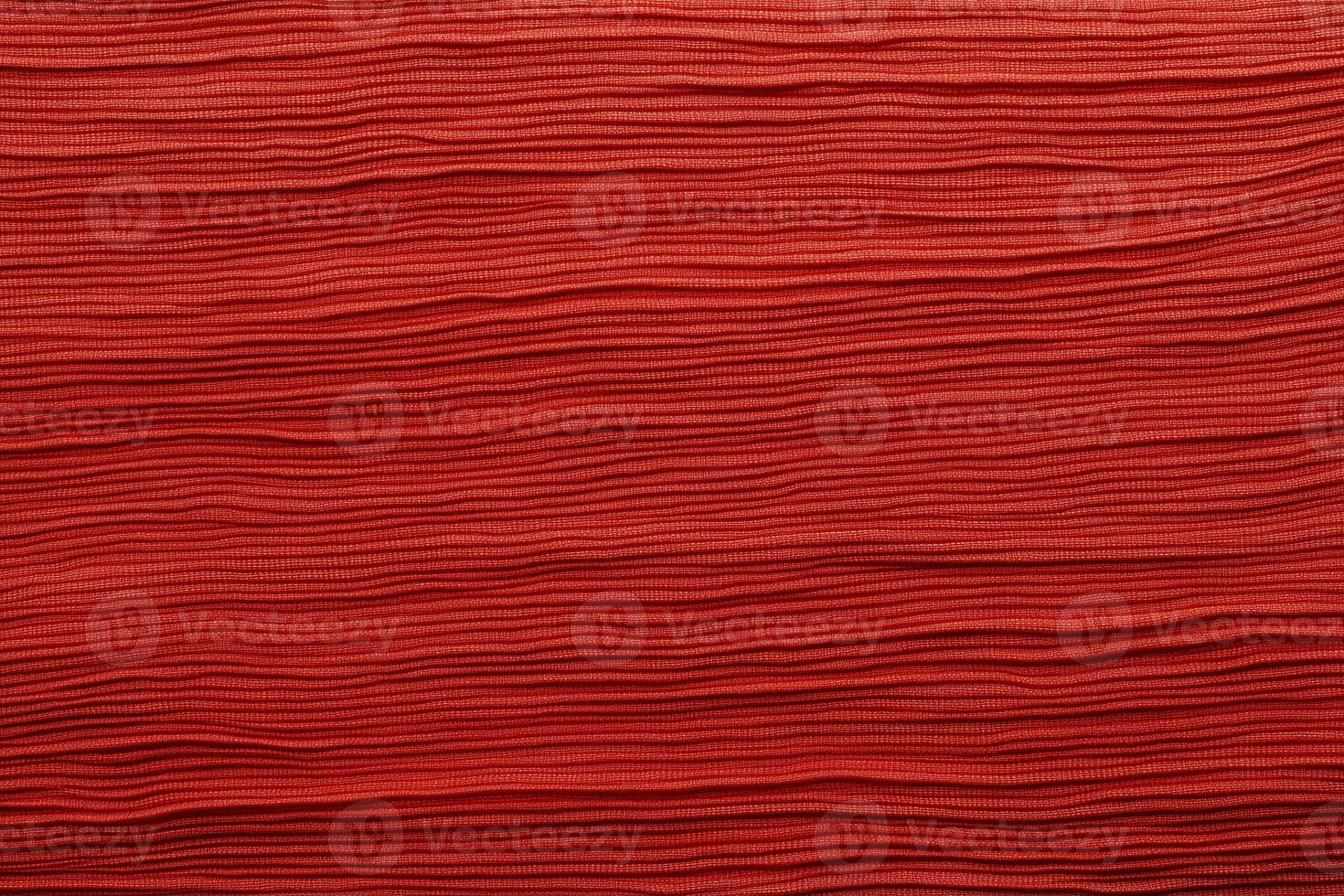 Carmine red wavy textured pattern with intricate fabric-like details and abstract design photo