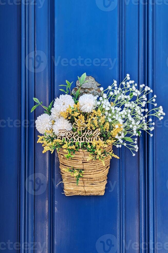 Soft blossoms elegantly spill from woven basket, arrangement capturing Easter spirit, arrangement blending pastel hues with subtle whimsy, arrangement perfect for springtime celebrations photo