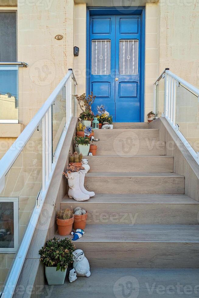 Bright boots filled with green sprouts highlight clever reuse of old shoes, shoes adding playful charm to porch, shoes uniting eco friendly mindset with whimsical yard appeal photo