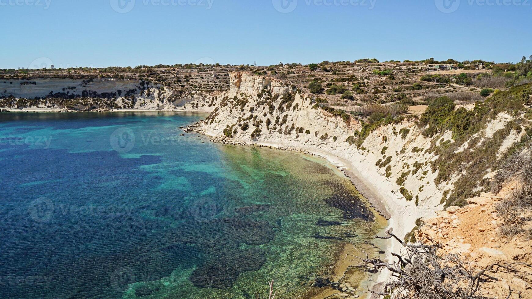 Tourism thrives along sunny Malta coast, tourism showcasing clear waters and rugged cliffs photo