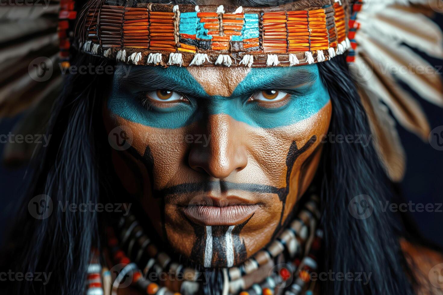 Close-Up of Man Wearing Traditional Headdress and Face Paint, Cultural Portrait, Intense Gaze photo