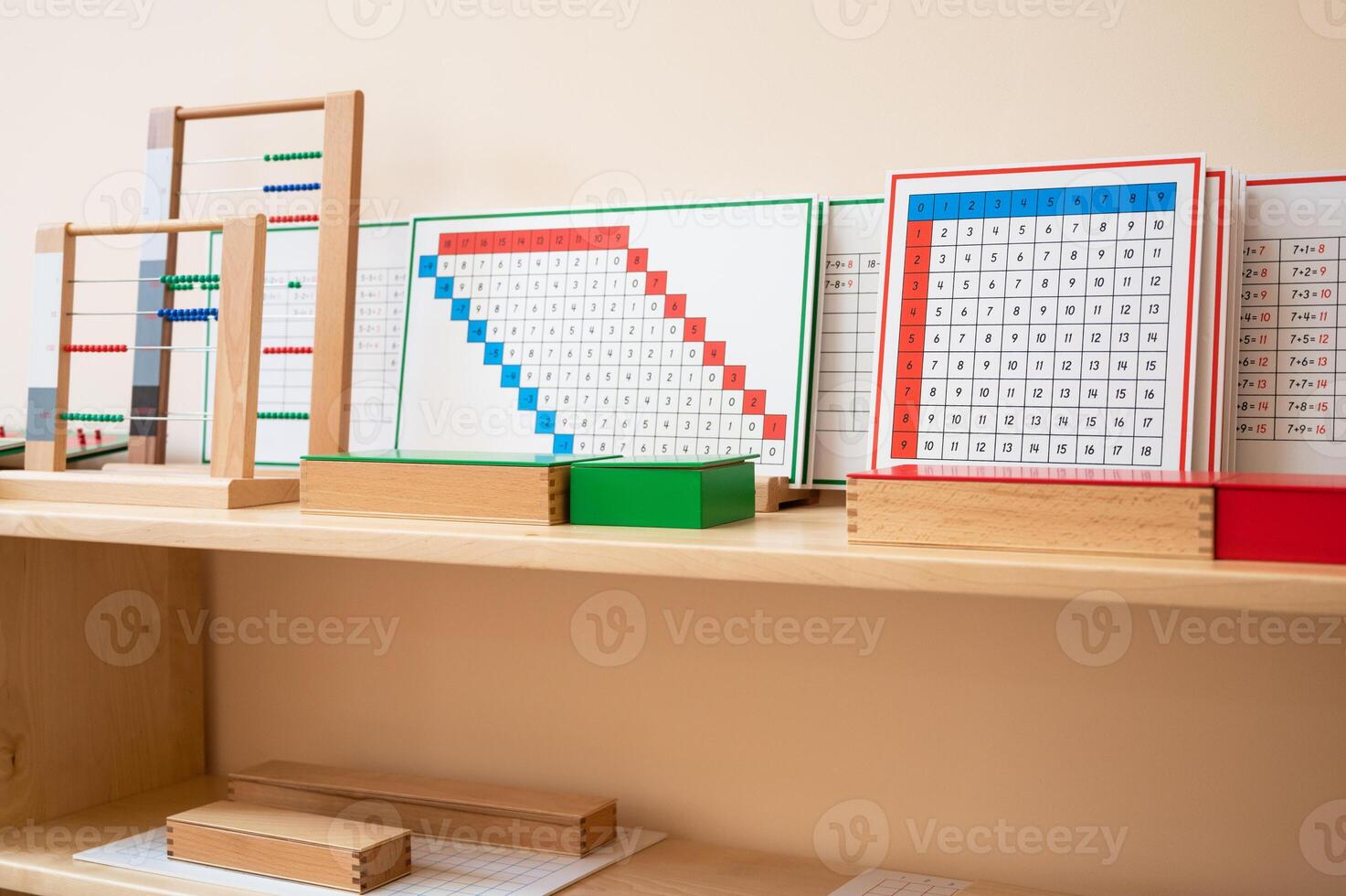 Montessori material. Wooden shelf with materials for Montessori studies photo