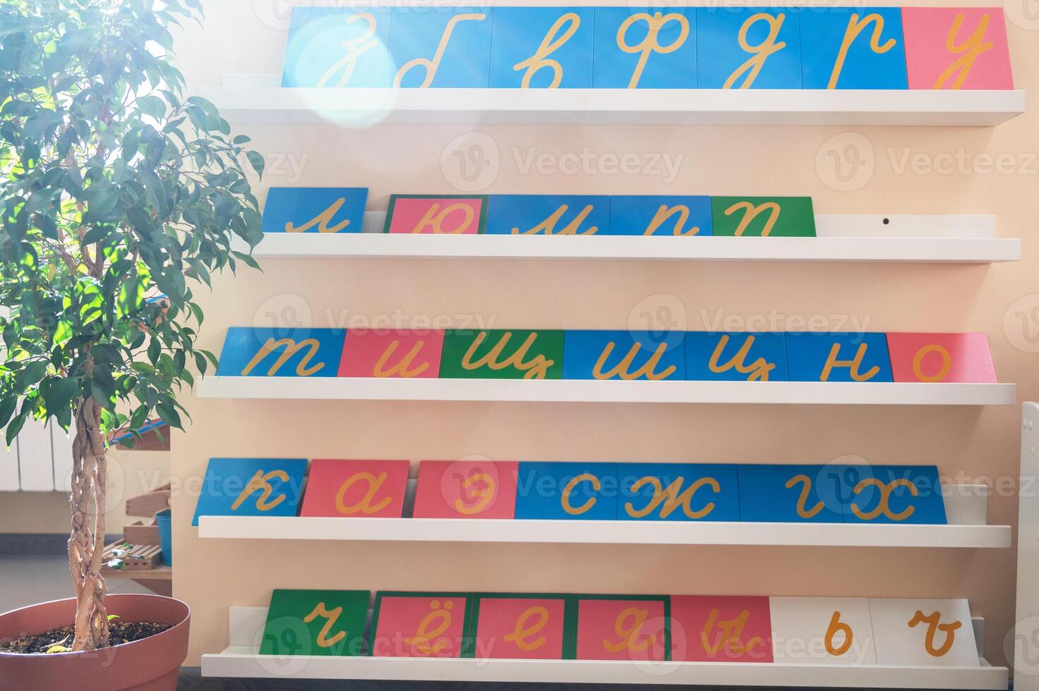 Montessori math materials including bead frames and number charts for hands-on learning, designed to teach arithmetic concepts to children. photo