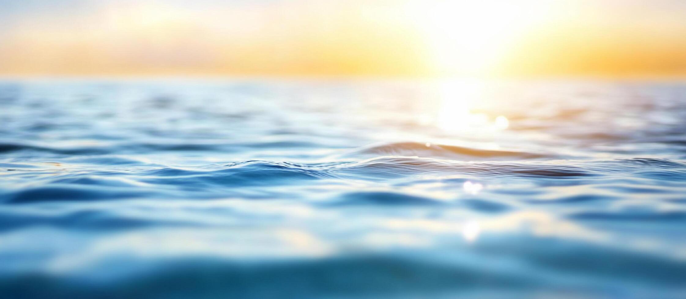 Serene water surface reflecting sunlight at dawn or dusk. photo