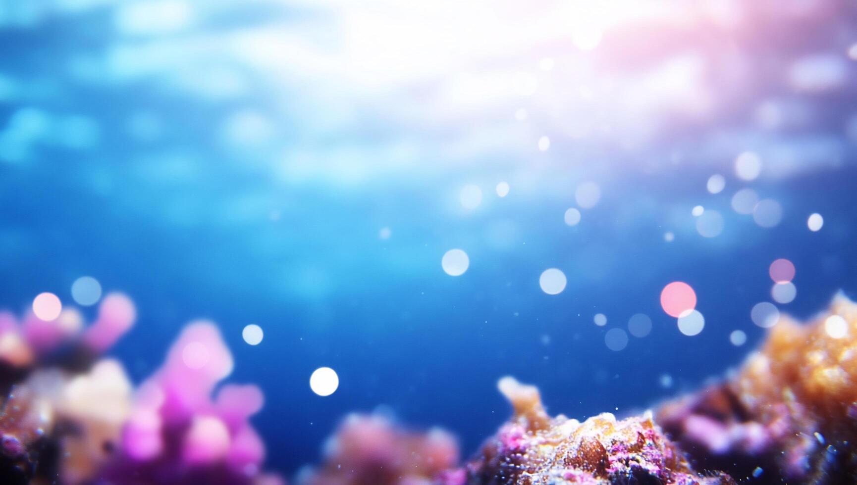Underwater scene featuring soft coral and shimmering light effects. photo