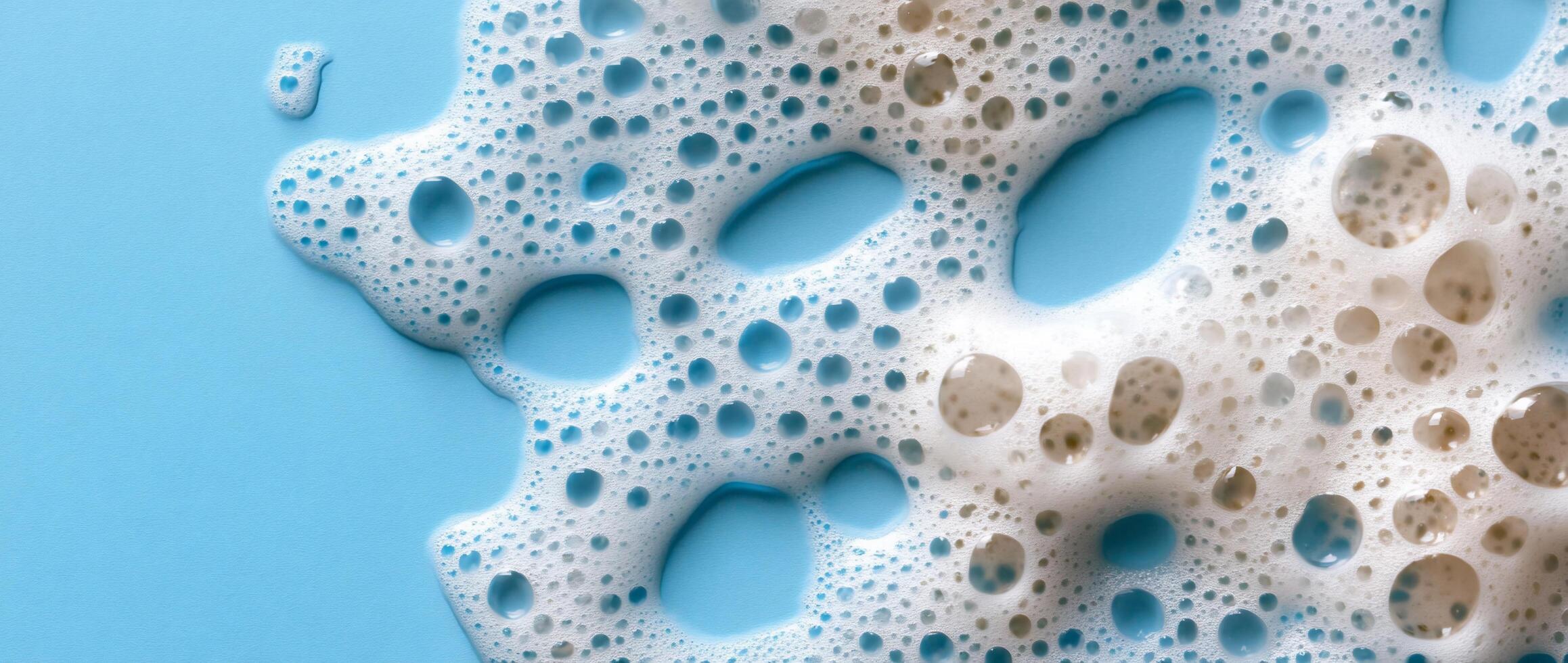 A close up of soap bubbles on a blue surface photo