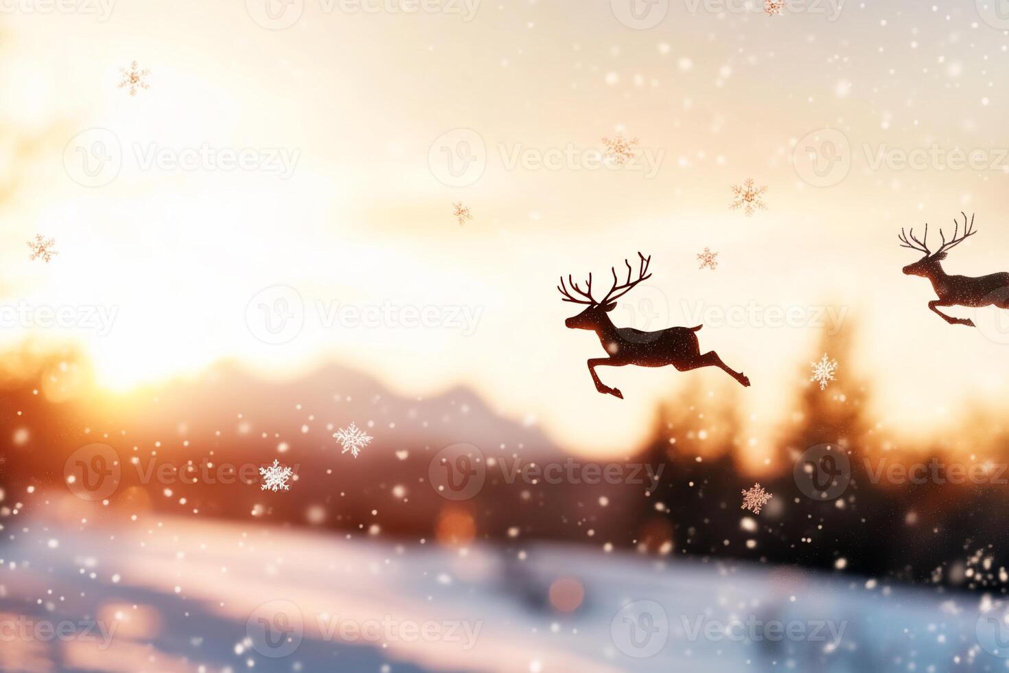 A silhouetted reindeer leaps against a snowy landscape at sunset. photo