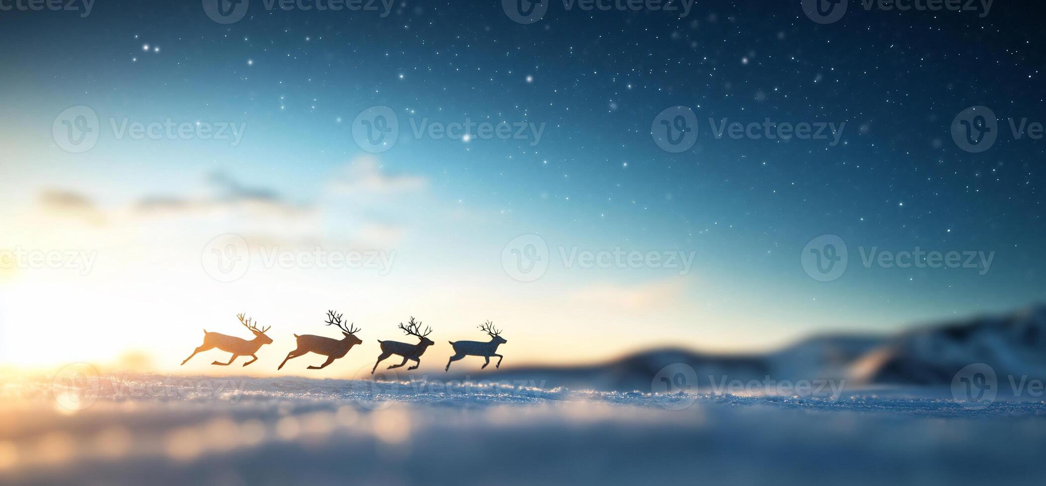 Reindeer running across a snowy landscape at sunset with stars above. photo