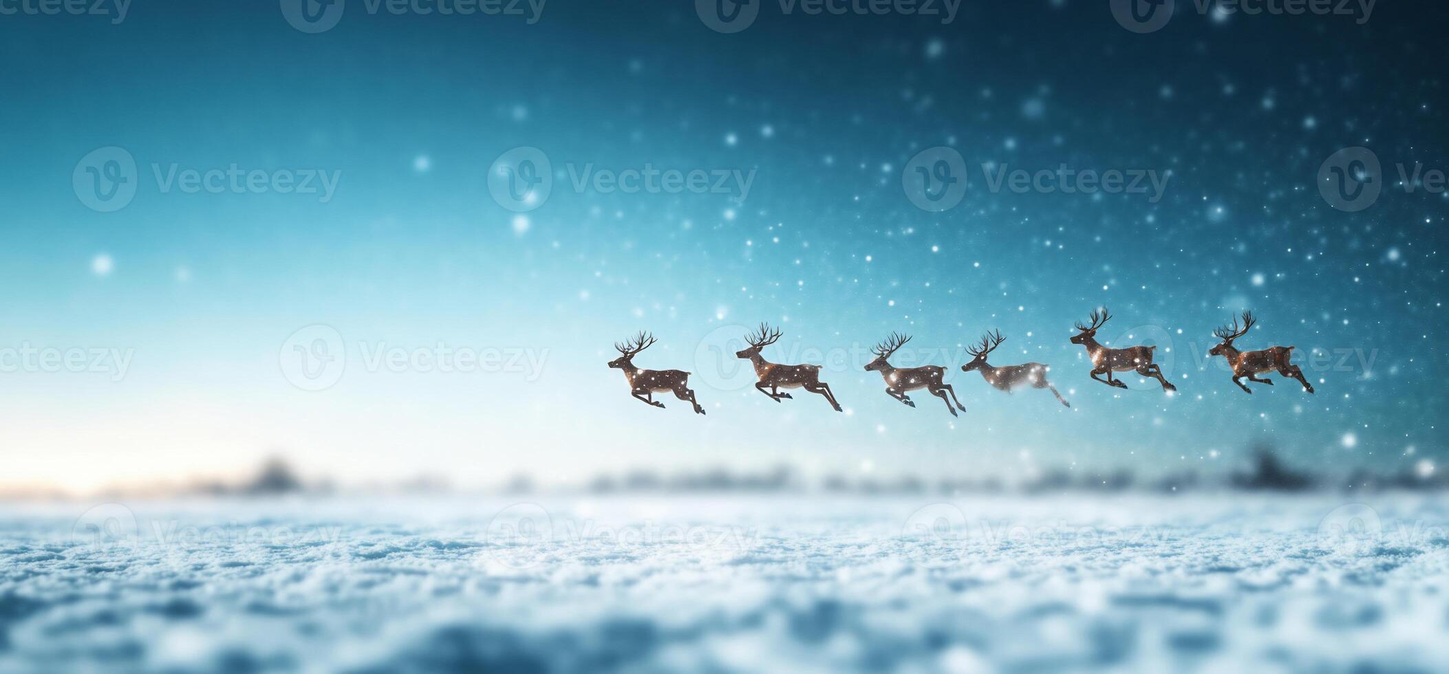 A winter scene with leaping reindeer against a snowy background. photo