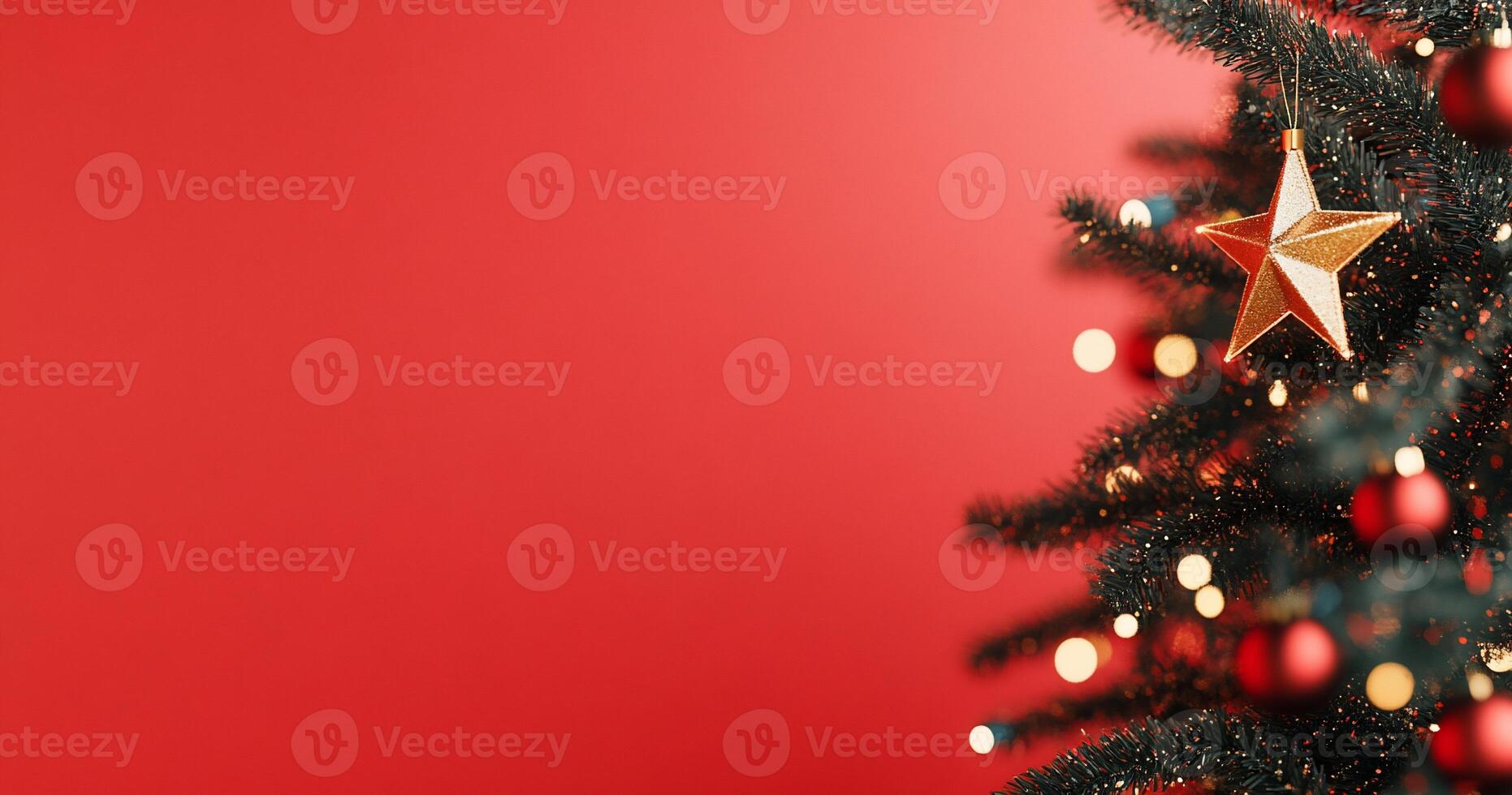 A festive Christmas tree adorned with a star and ornaments against a red backdrop. photo