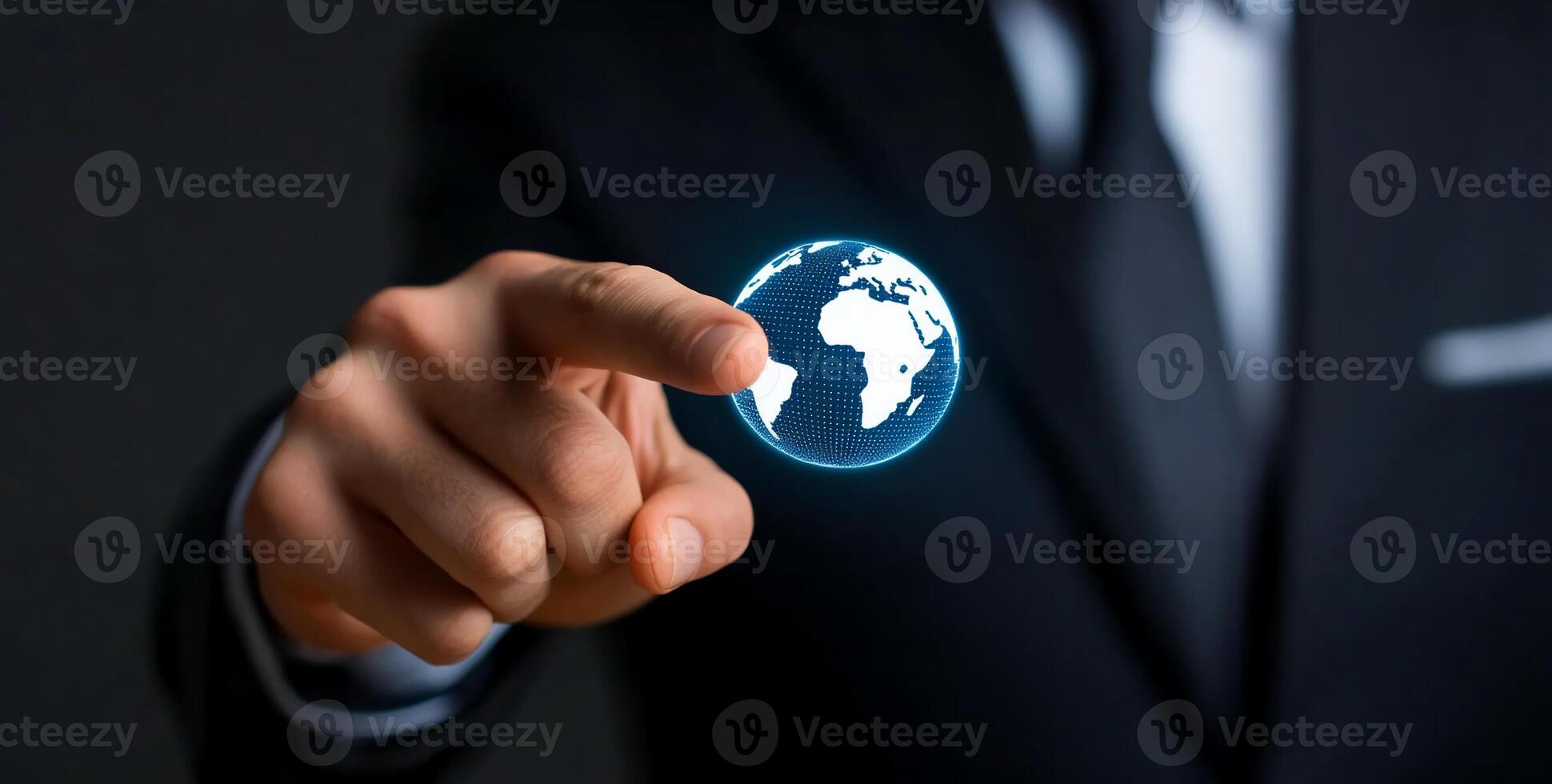 A businessman interacts with a digital globe, symbolizing global connectivity. photo